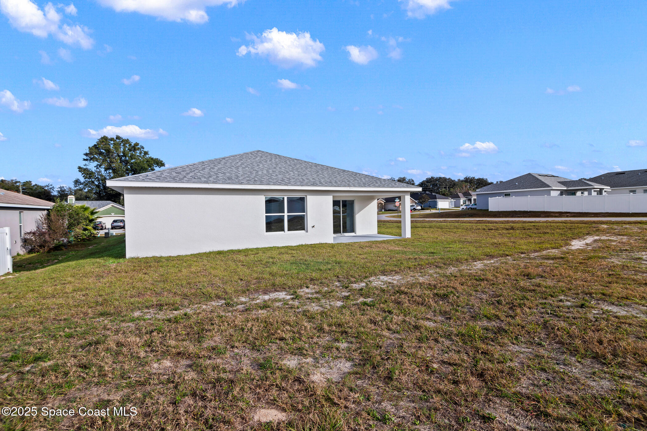 5346 Southeast 91st Street Ocala, FL 34480 - Photo 37 of 38 a view of a house with a garden and yard