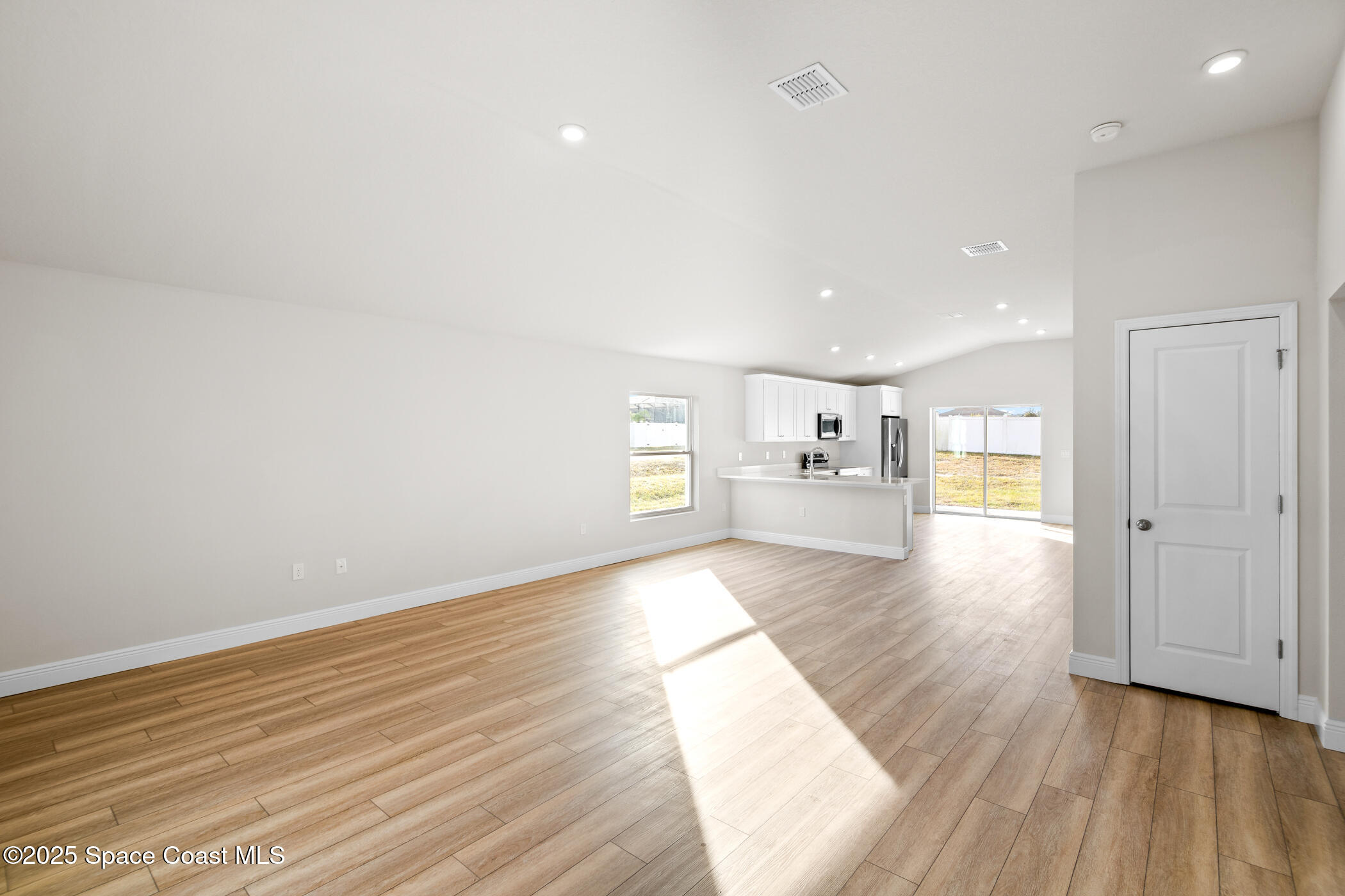 5346 Southeast 91st Street Ocala, FL 34480 - Photo 7 of 38 a view of empty room with wooden floor