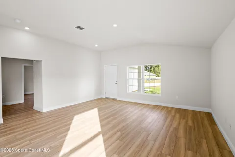 a view of kitchen with cabinets