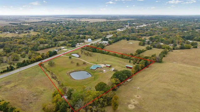 a living room with furniture window and a flat screen tv