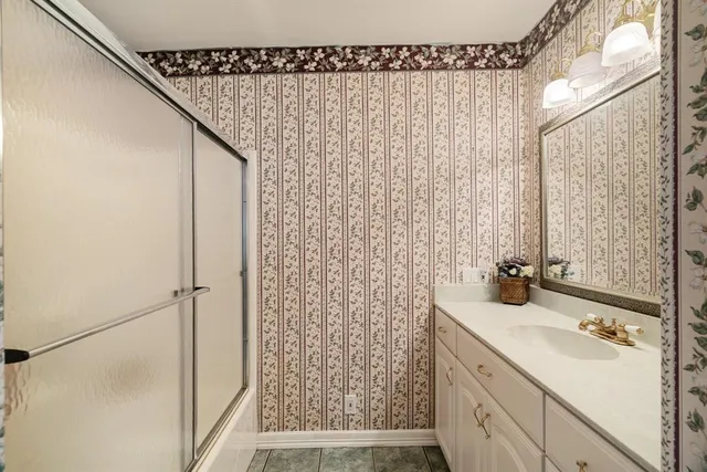 a kitchen with stainless steel appliances kitchen island granite countertop a refrigerator and a stove top oven