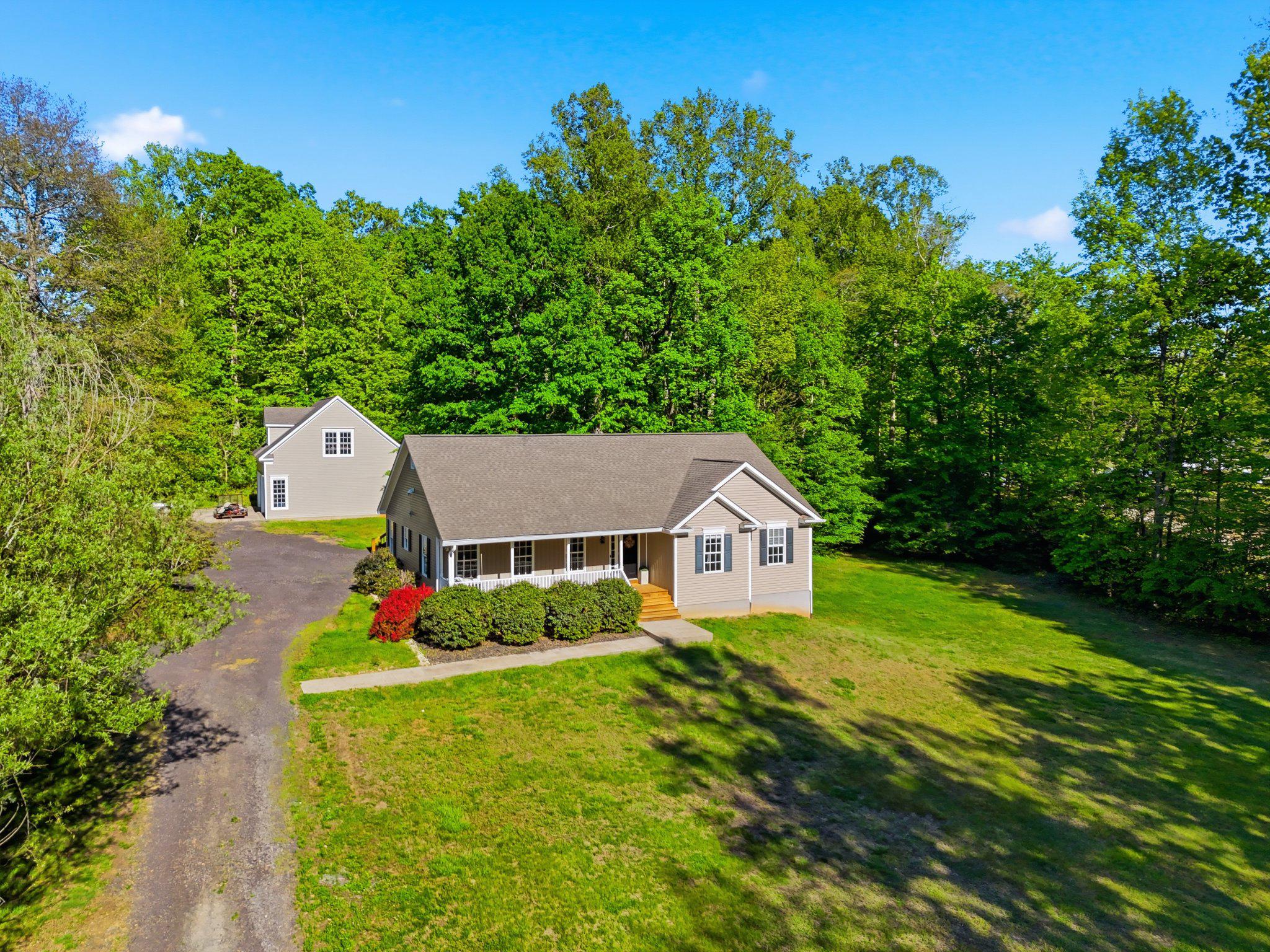 1522 Meander Run Road Locust Dale, VA 22948 - Photo 3 of 72 a house with green field in front of it