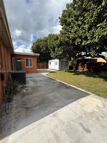 a view of a house with a yard and garage