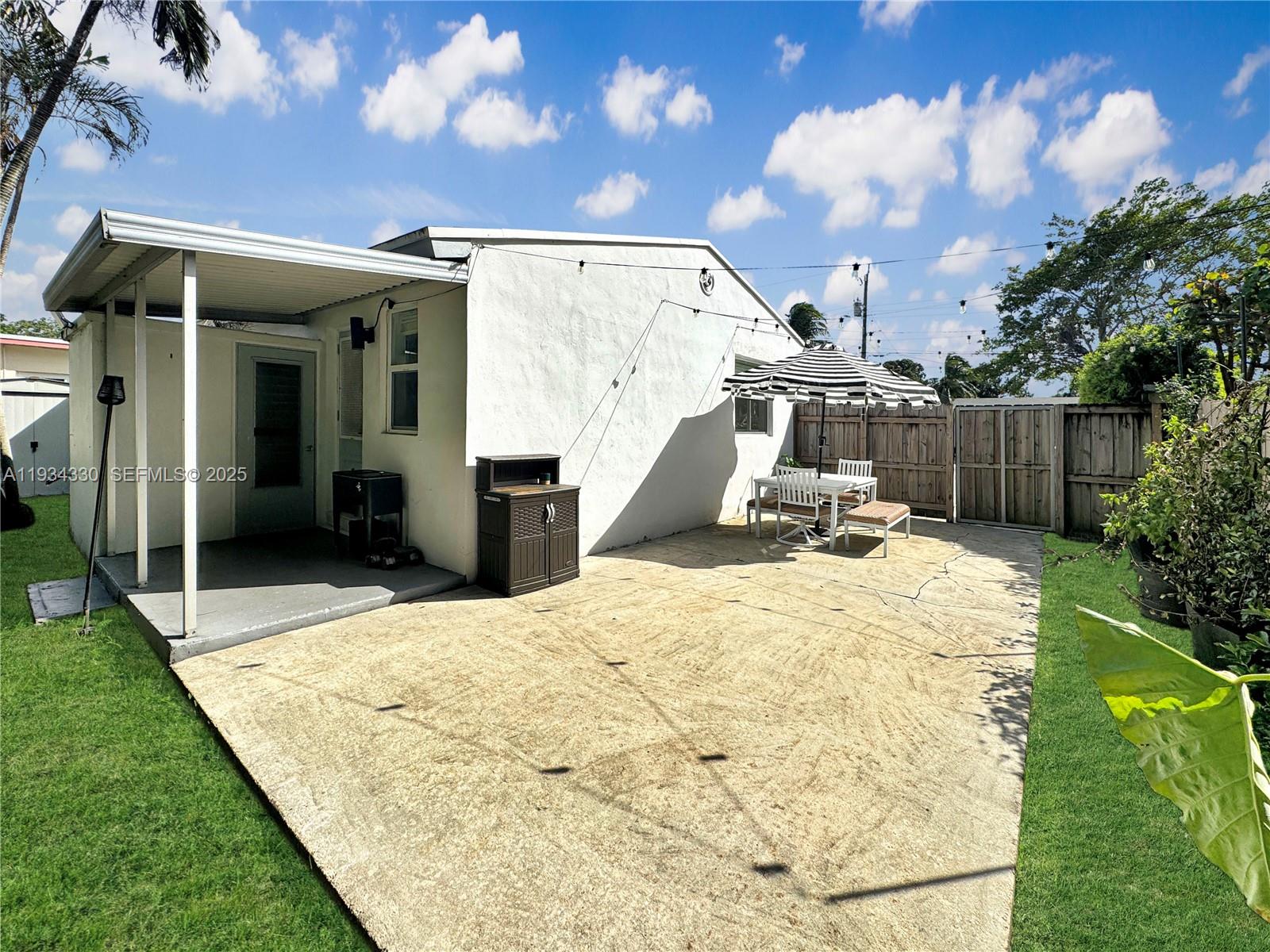 640 Southwest 6th Street Hallandale Beach, FL 33009 - Photo 14 of 18 a view of a swimming pool with a patio