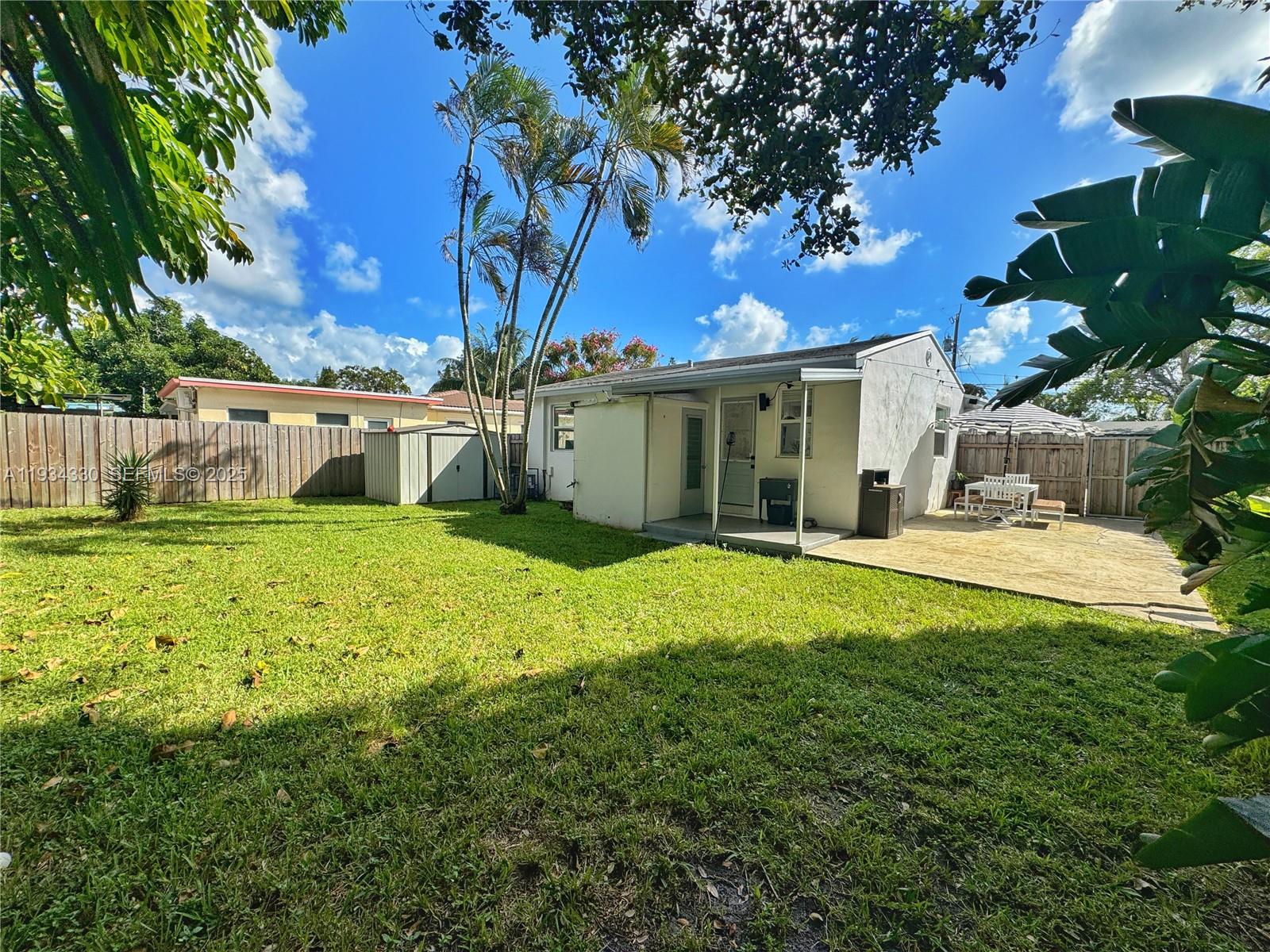 640 Southwest 6th Street Hallandale Beach, FL 33009 - Photo 16 of 18 a view of a house with a yard