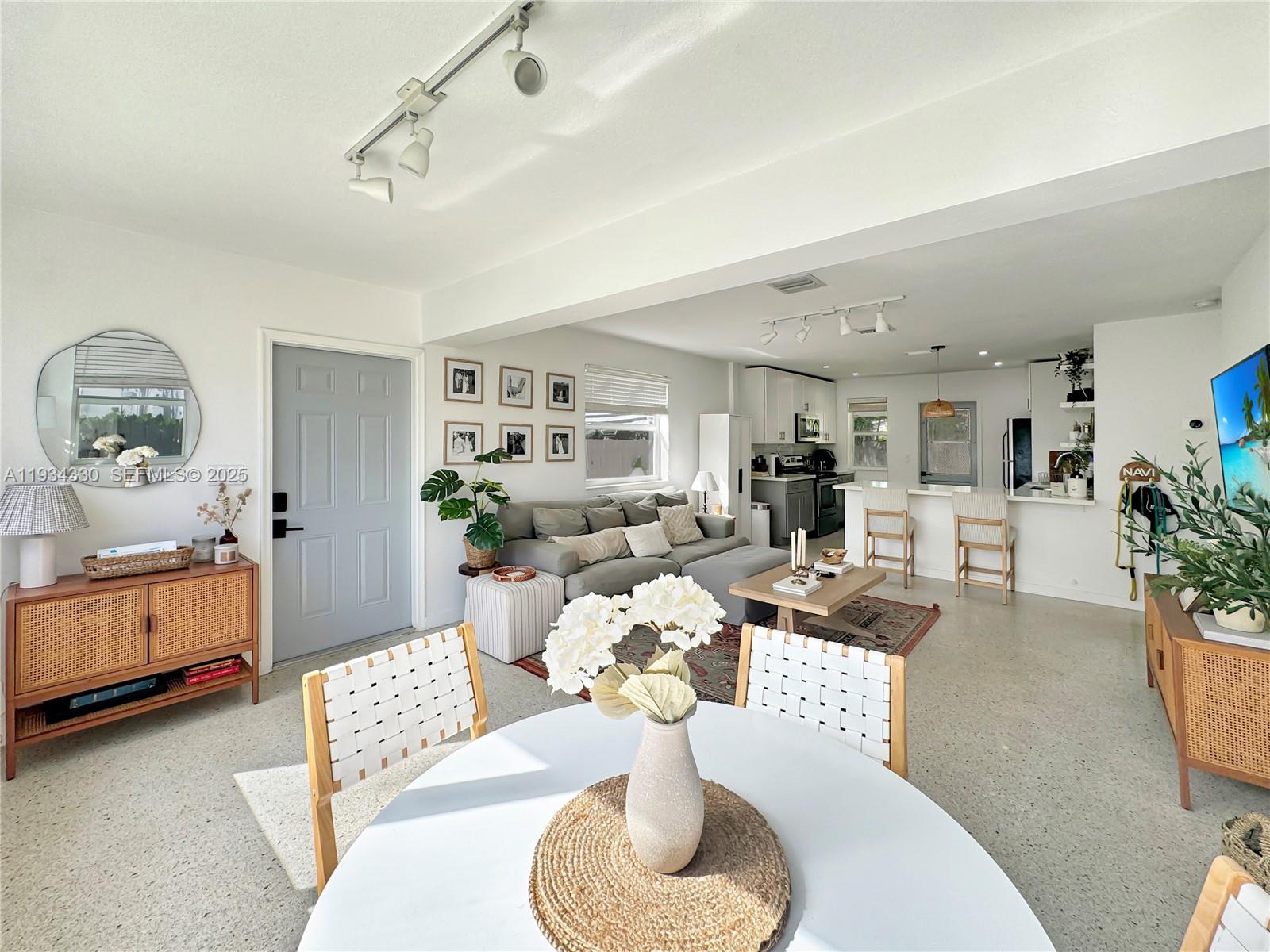 640 Southwest 6th Street Hallandale Beach, FL 33009 - Photo 5 of 18 a living room with furniture and a lamp