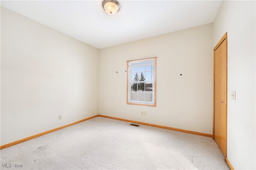 706 Watson Road Deerfield, OH 44411 - Photo 21 of 36 Unfurnished room with carpet floors