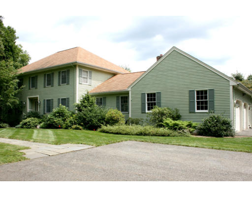 81 Boston Post Road Wayland, MA 01778 - Photo 1 of 1 a front view of a house with a yard