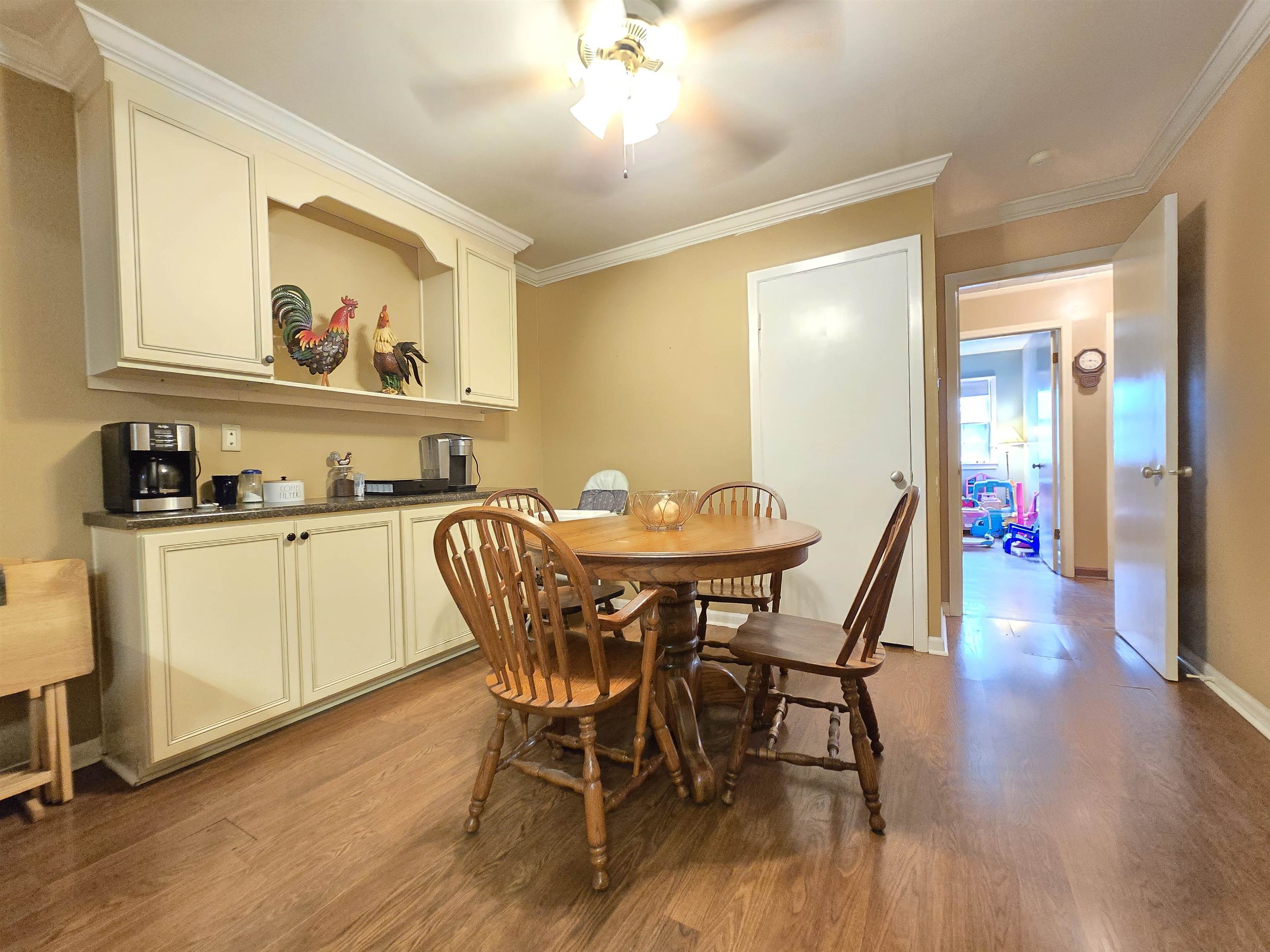 4885 Macon Road Memphis, TN 38122 - Photo 17 of 39 a view of a dining room with furniture and wooden floor