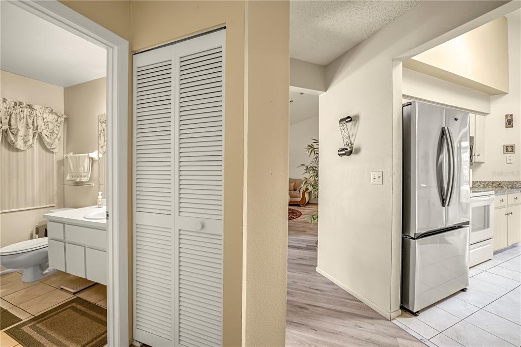 12196 Bluefield Street Spring Hill, FL 34609 - Photo 20 of 47 a bathroom with a refrigerator and a window