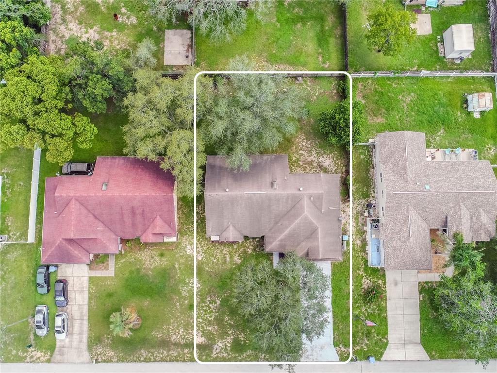 12196 Bluefield Street Spring Hill, FL 34609 - Photo 2 of 47 an aerial view of a house with outdoor space and street view