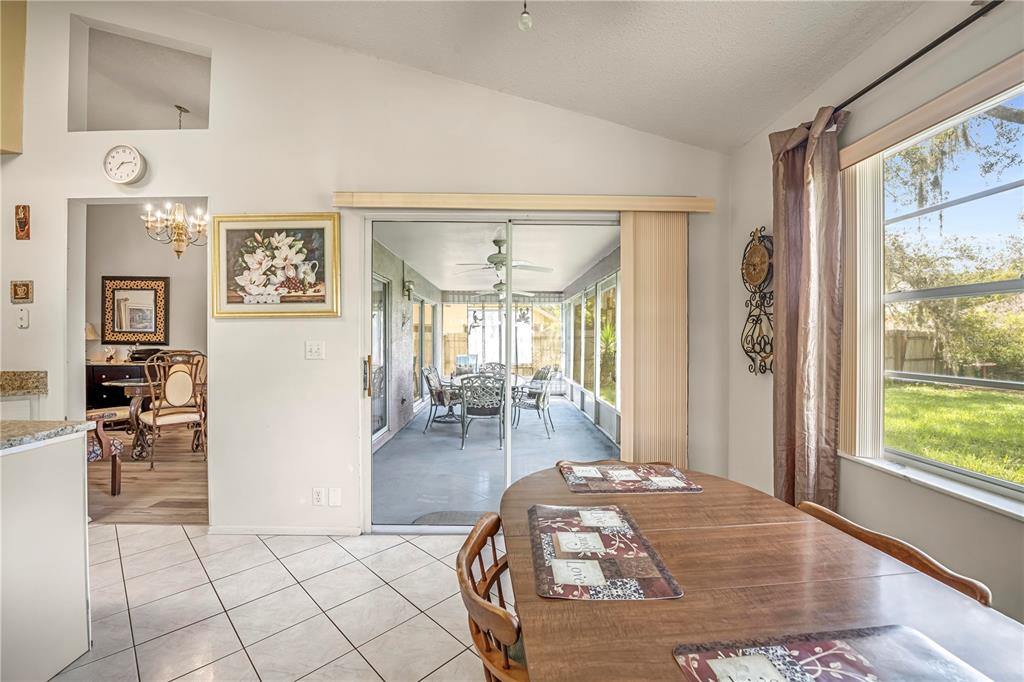 12196 Bluefield Street Spring Hill, FL 34609 - Photo 21 of 47 a living room with furniture and a large window