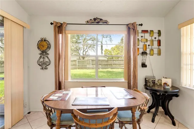 a dining room with a table and chairs