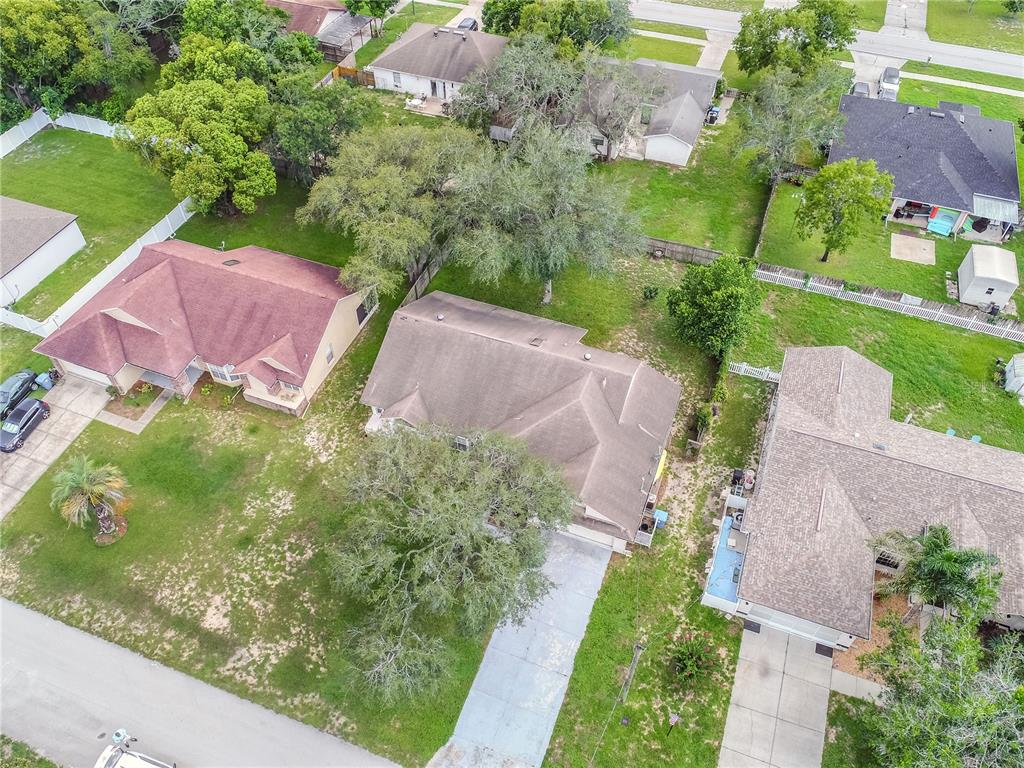 12196 Bluefield Street Spring Hill, FL 34609 - Photo 24 of 47 a view of a street with potted plants and large trees