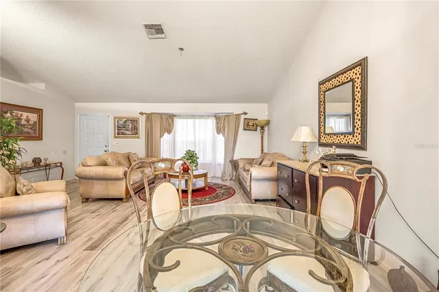 a living room with furniture and a table