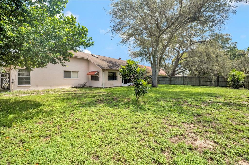 12196 Bluefield Street Spring Hill, FL 34609 - Photo 47 of 47 a view of a house with a yard