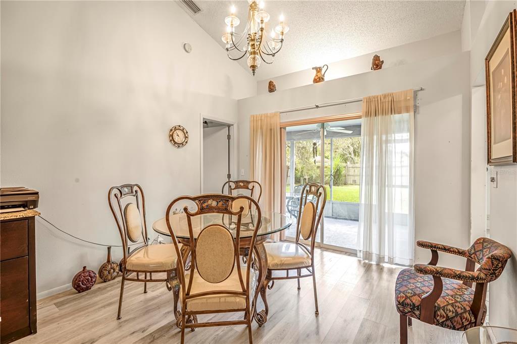 12196 Bluefield Street Spring Hill, FL 34609 - Photo 5 of 47 a view of a dining room with furniture window and outside view