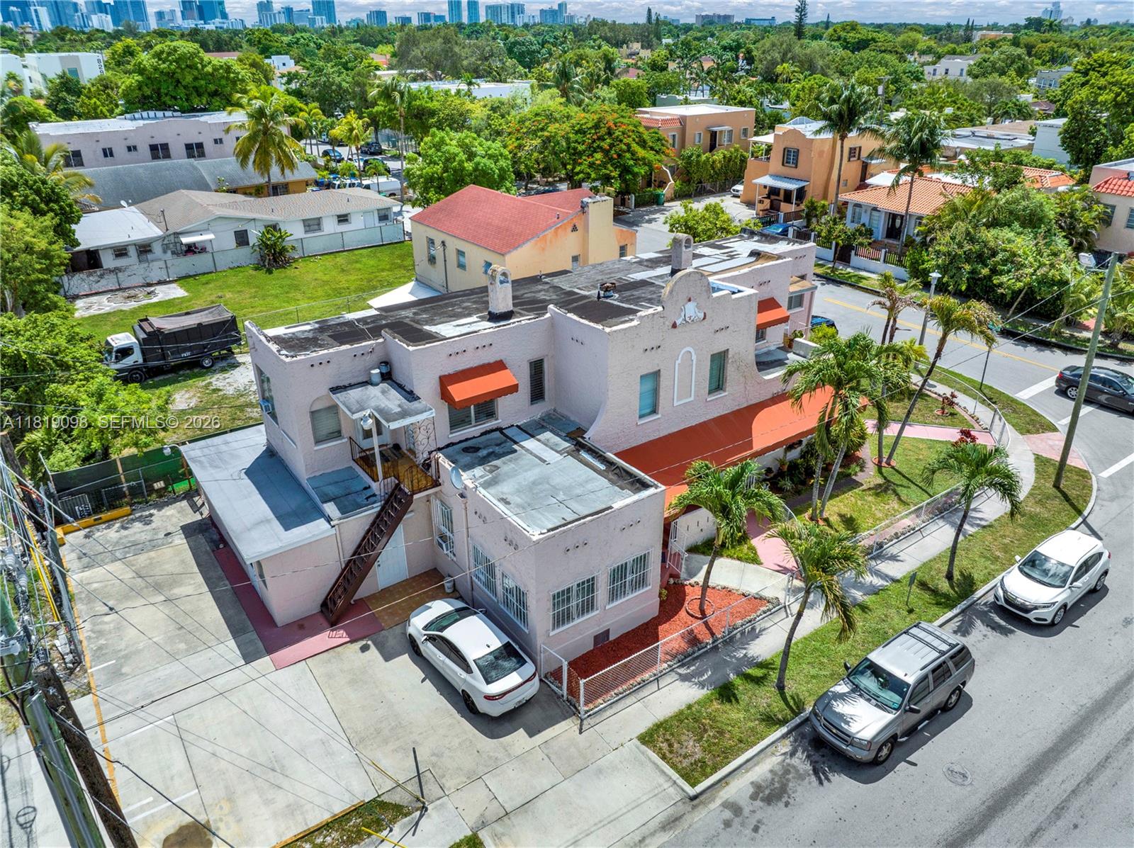 829 Southwest 19th Avenue Miami, FL 33135 - Photo 4 of 54 an aerial view of a house with a garden and lake view
