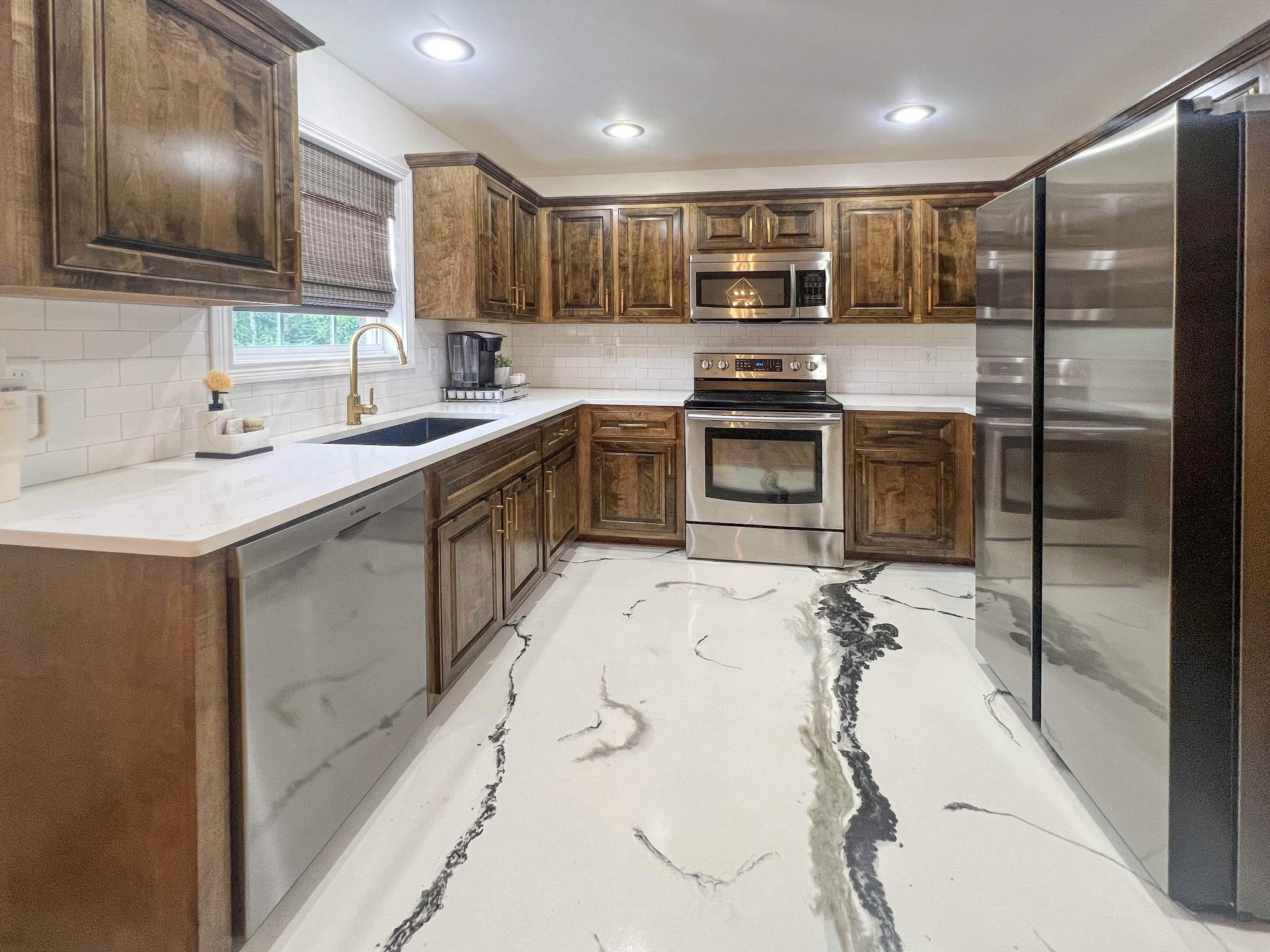319 Wynns Ferry Road Dover, TN 37058 - Photo 12 of 27 a kitchen with stainless steel appliances kitchen island granite countertop a sink stove and refrigerator