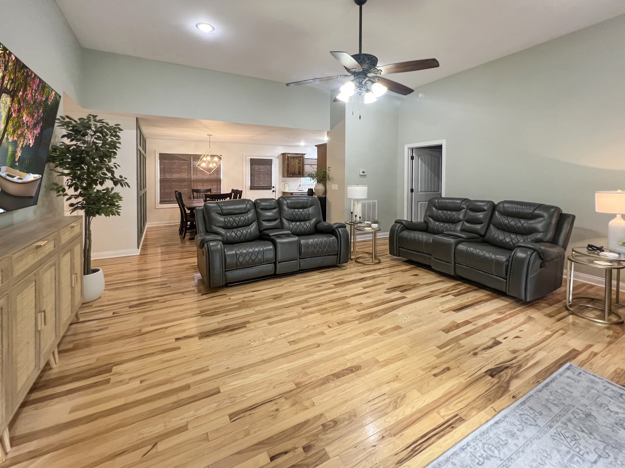 319 Wynns Ferry Road Dover, TN 37058 - Photo 9 of 27 a living room with furniture and a chandelier
