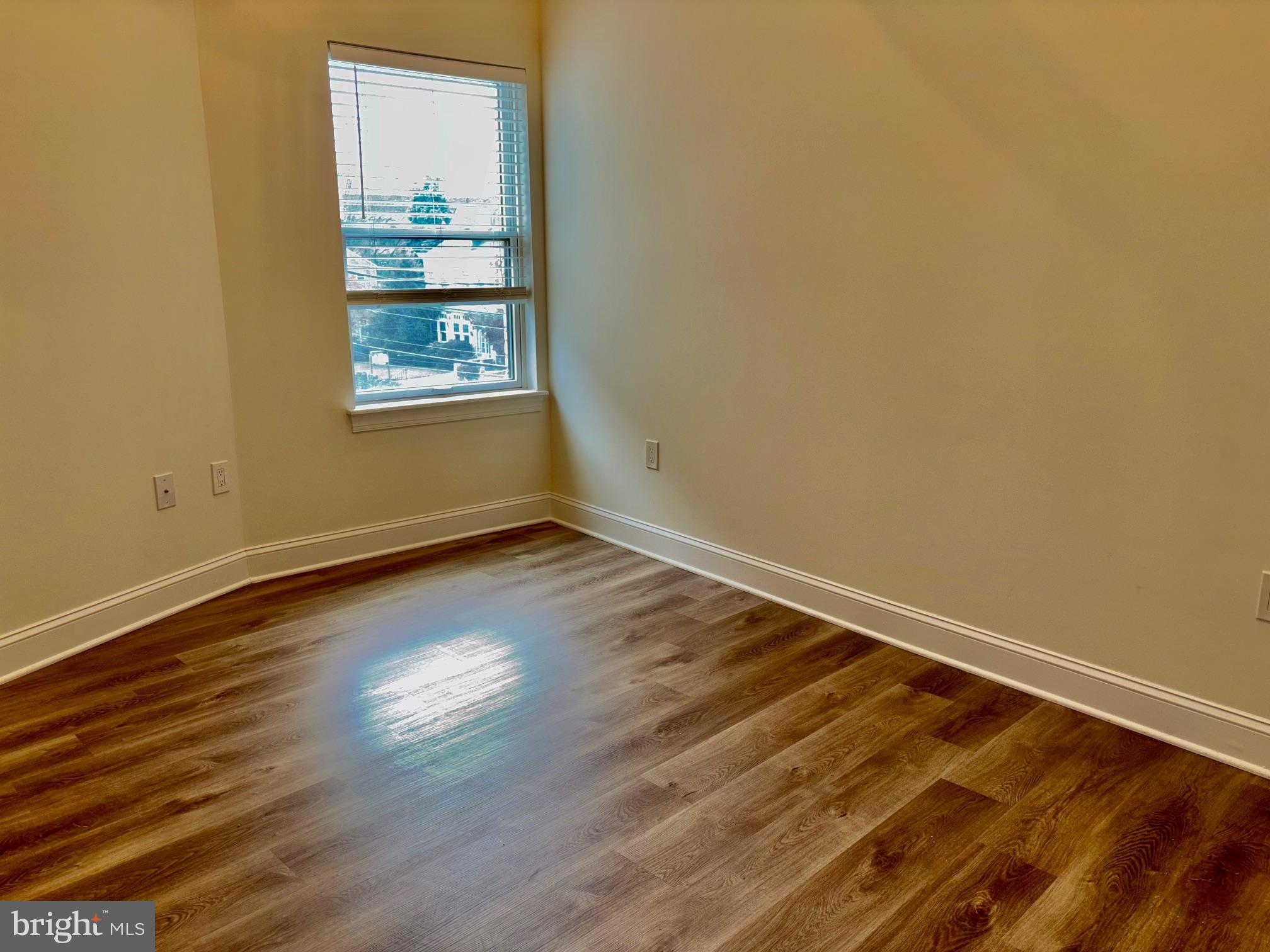 6601 Ridge Avenue, Unit D Philadelphia, PA 19128 - Photo 5 of 10 a view of a room with wooden floor and window