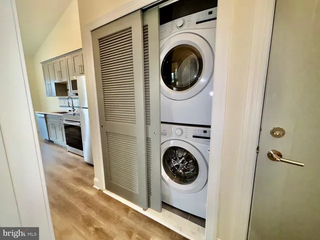 a view of a hallway with washer and dryer