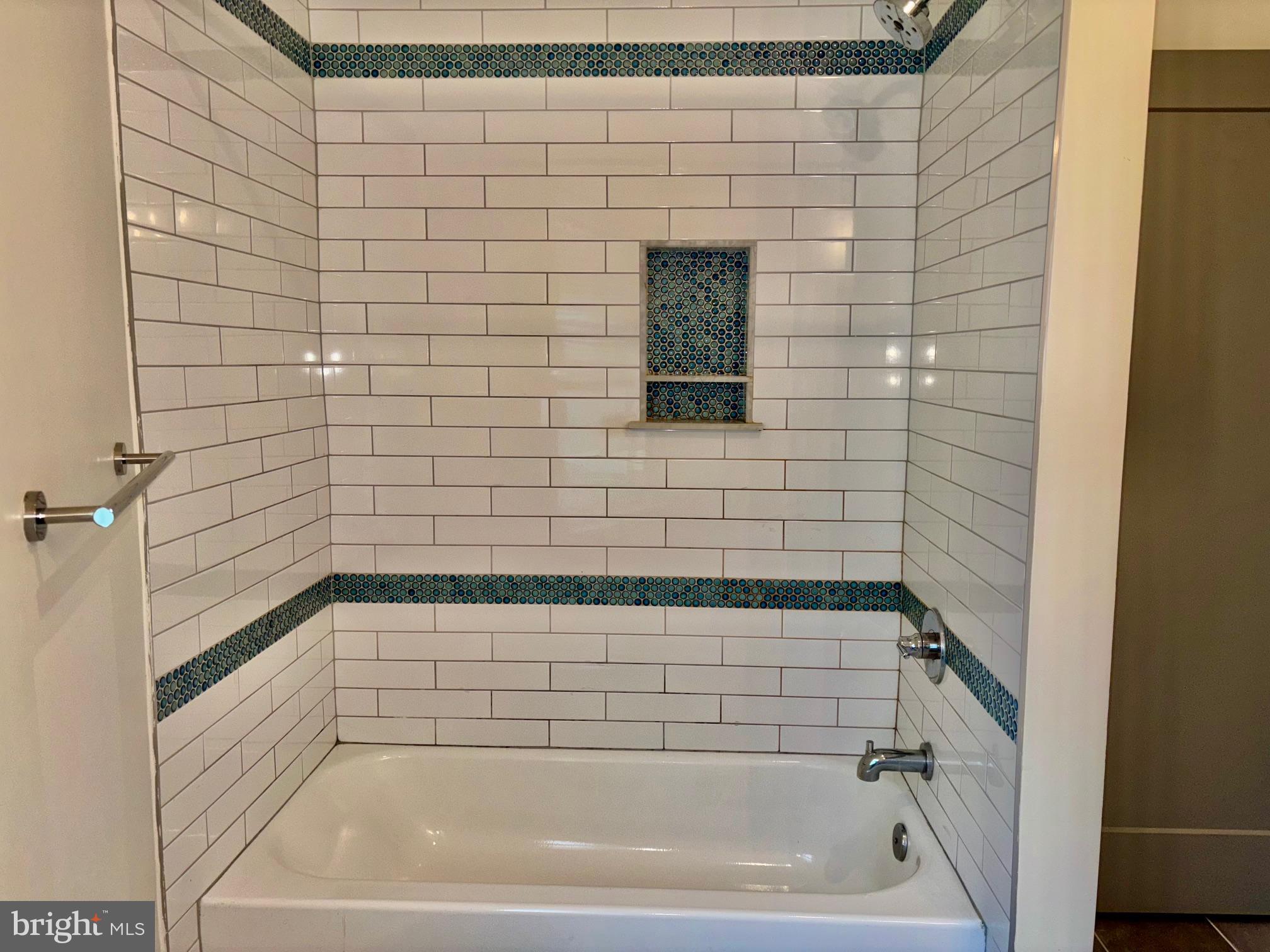 6601 Ridge Avenue, Unit D Philadelphia, PA 19128 - Photo 8 of 10 a bathroom with a bathtub