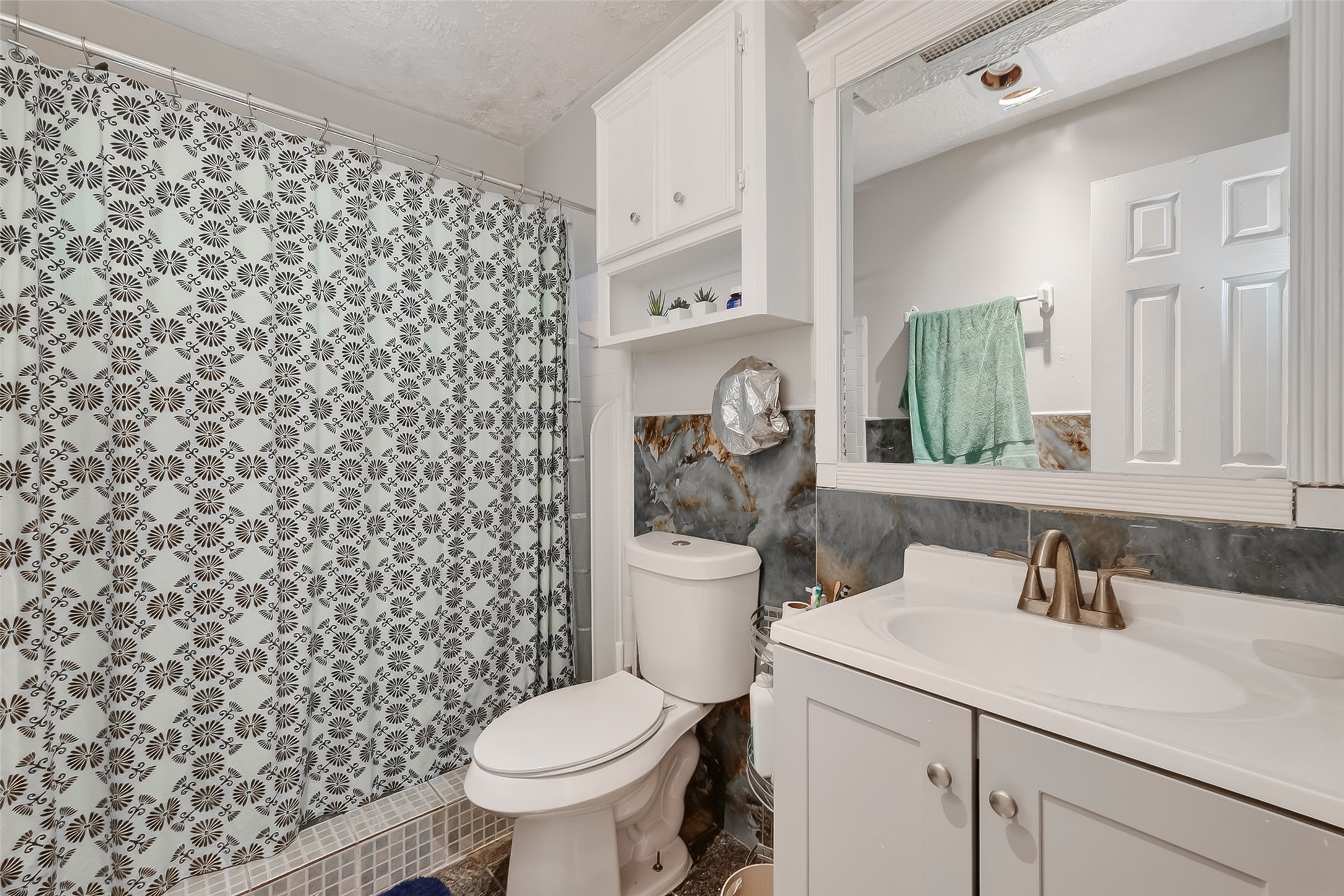 9718 Whitepost Lane Houston, TX 77086 - Photo 12 of 18 a bathroom with a sink toilet and shower