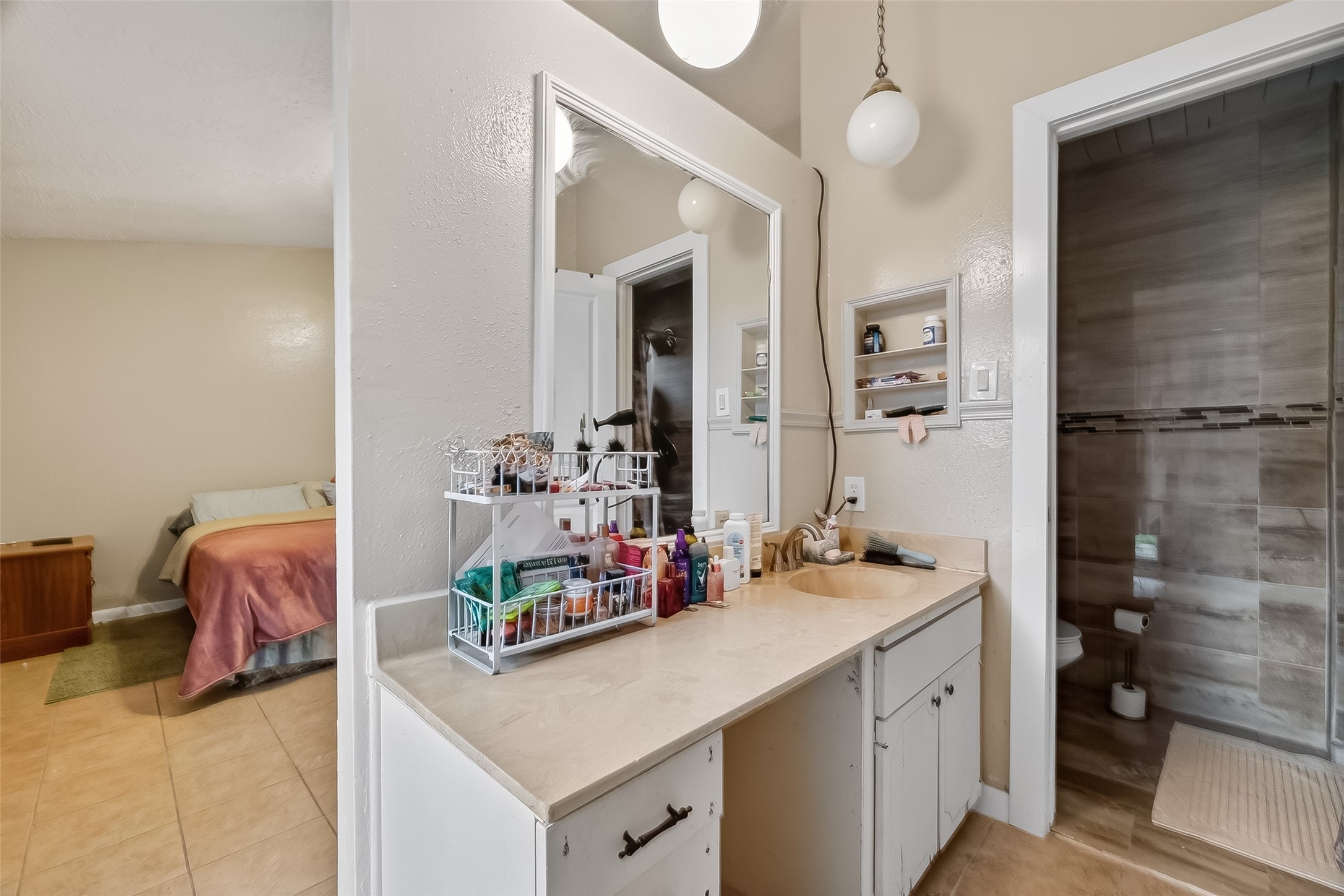 9718 Whitepost Lane Houston, TX 77086 - Photo 15 of 18 a bathroom with a sink double vanity and a mirror