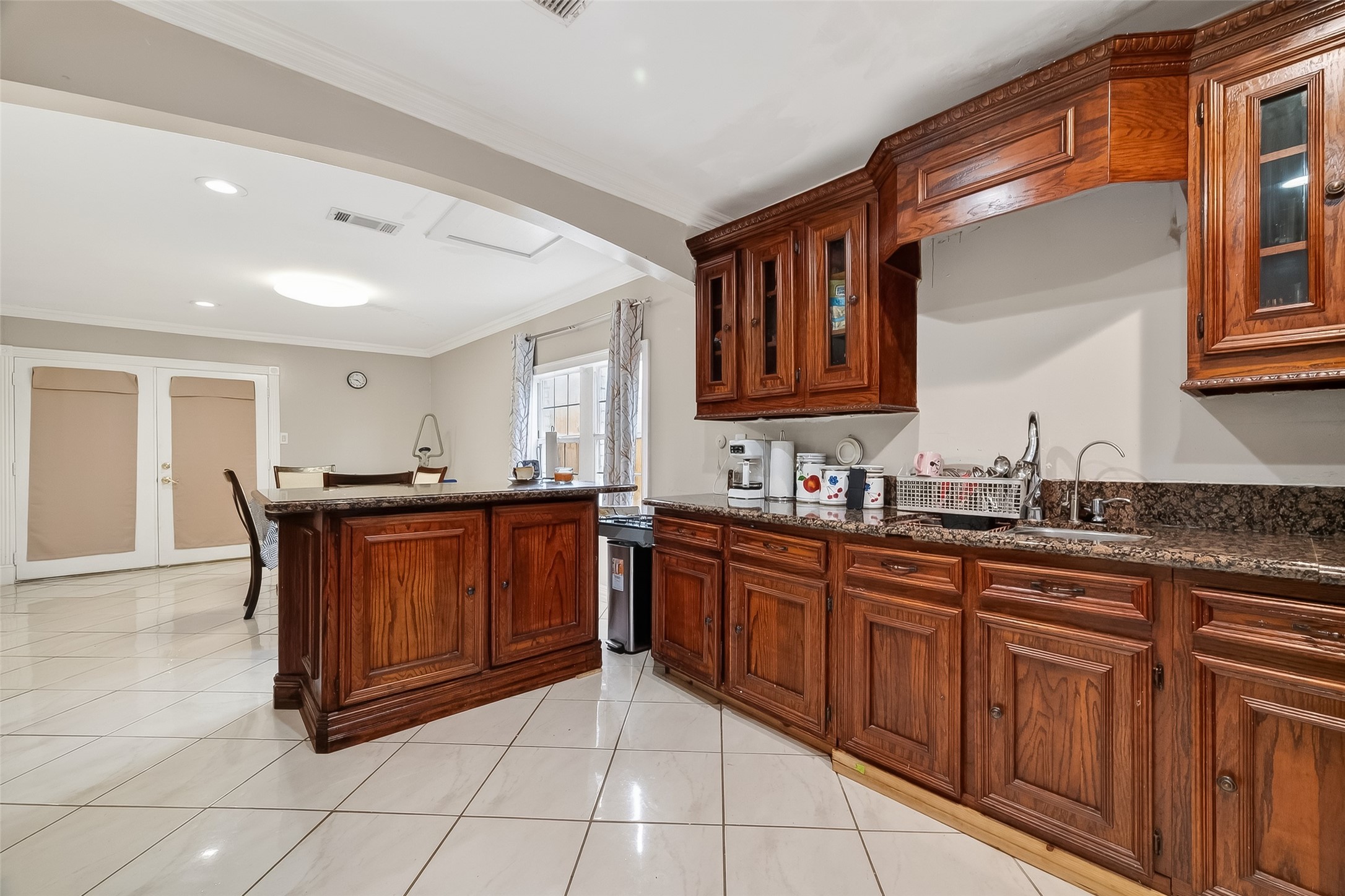 9718 Whitepost Lane Houston, TX 77086 - Photo 9 of 18 a kitchen with stainless steel appliances granite countertop a sink and cabinets