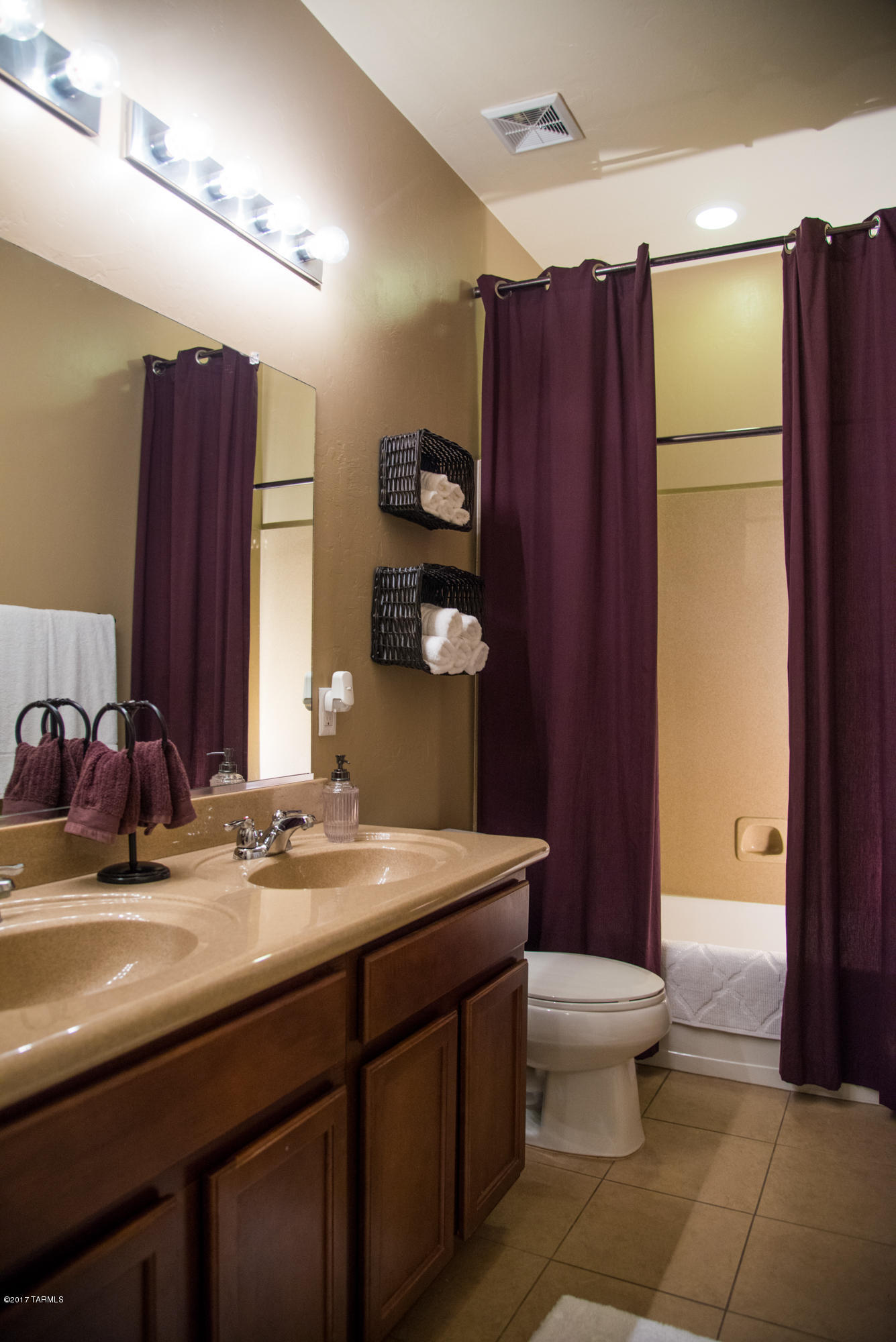4405 West Crystal Ranch Place Marana, AZ 85658 - Photo 32 of 44 a bathroom with a sink a toilet and mirror
