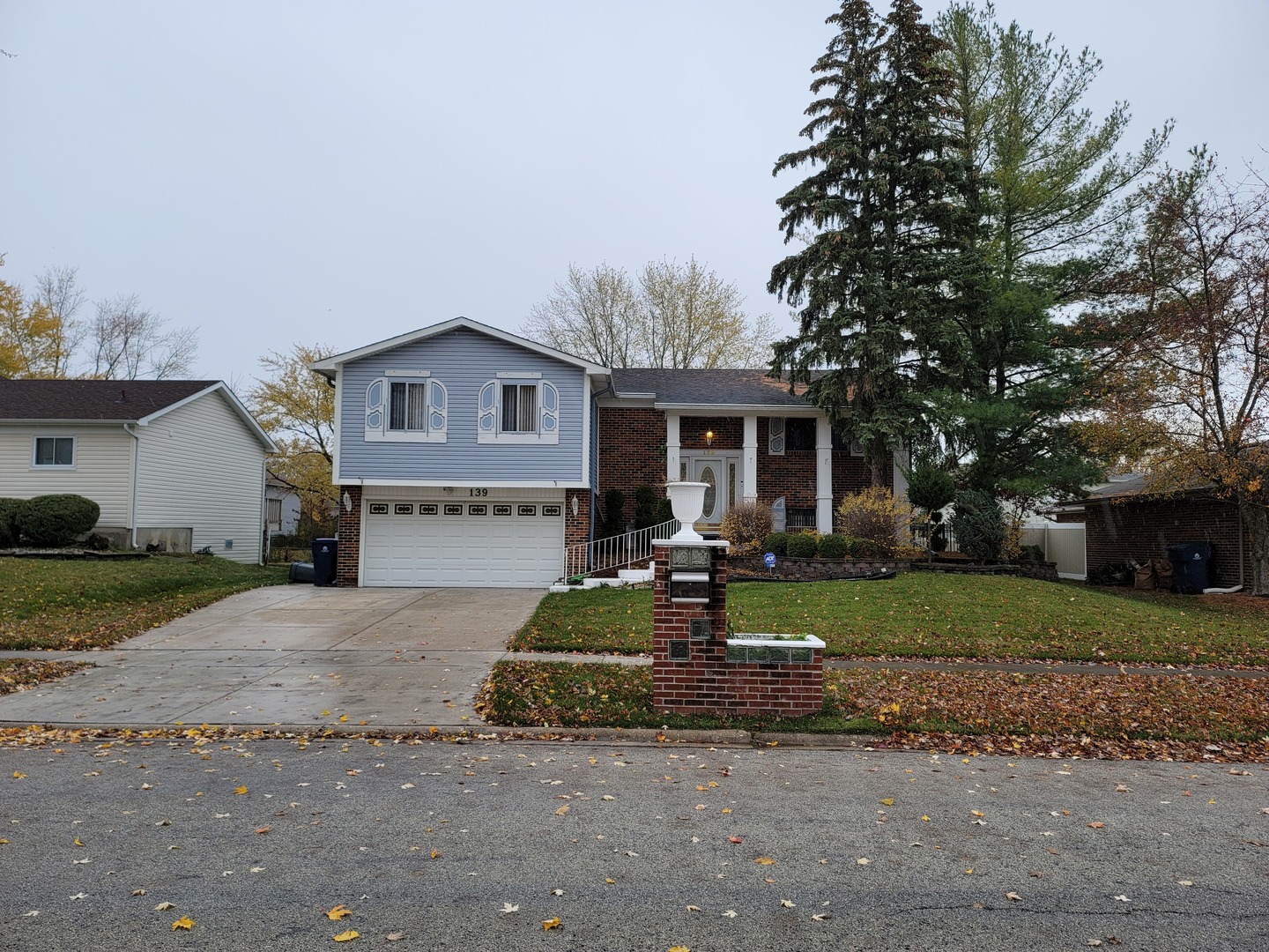 139 Pheasant Road Matteson, IL 60443 - Photo 1 of 2 a front view of a house with a yard and trees