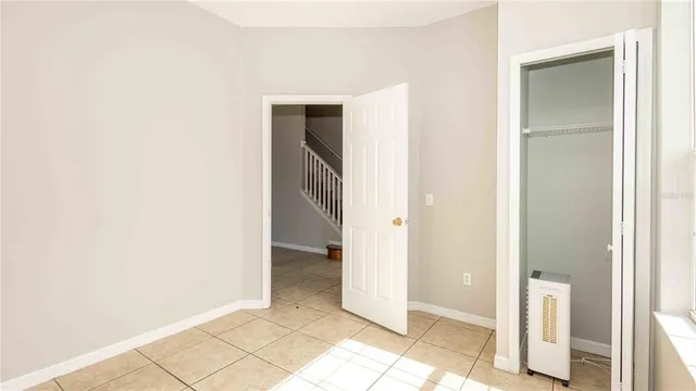 a view of an empty room with wooden door