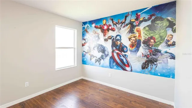 a view of a painting on the wall and a window