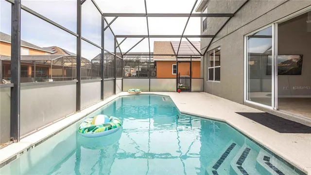 a indoor swimming pool with a outdoor seating