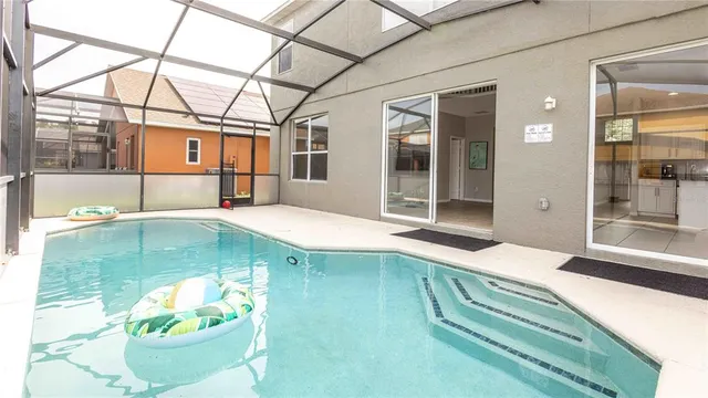 a swimming pool with potted plants
