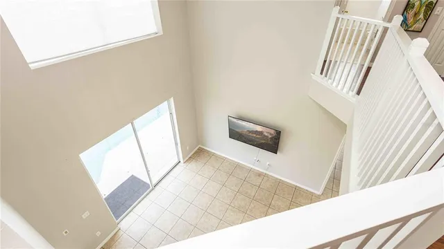 a view of a living room with furniture and a fireplace