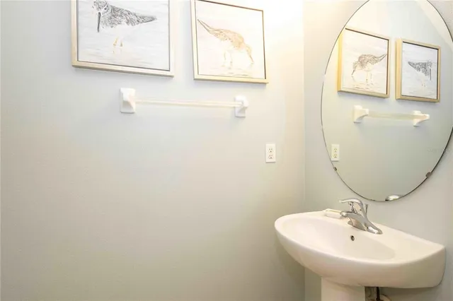 a bathroom with a sink and mirror