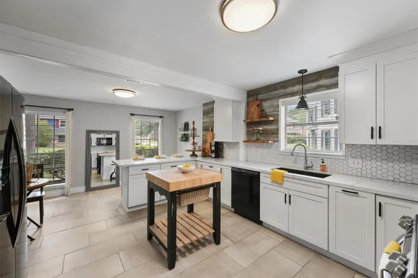a kitchen with refrigerator and stove