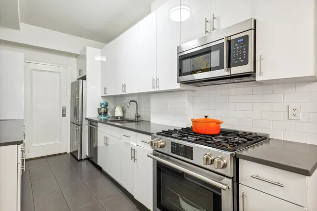 a room with wooden floor and a window