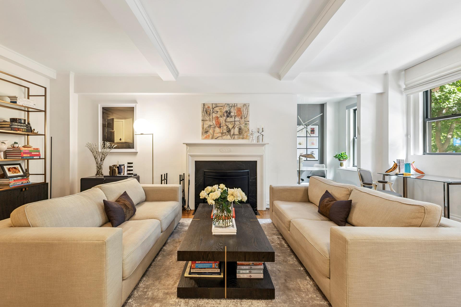 242 East 19th Street, Unit 2C Manhattan, NY 10003 - Photo 8 of 9 a living room with furniture and a fireplace