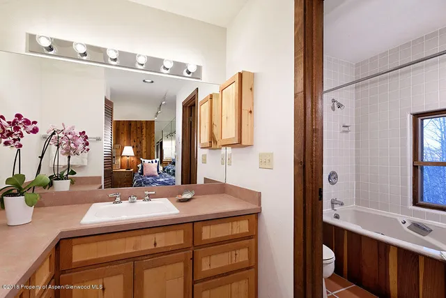 a bathroom with a sink vanity and a mirror