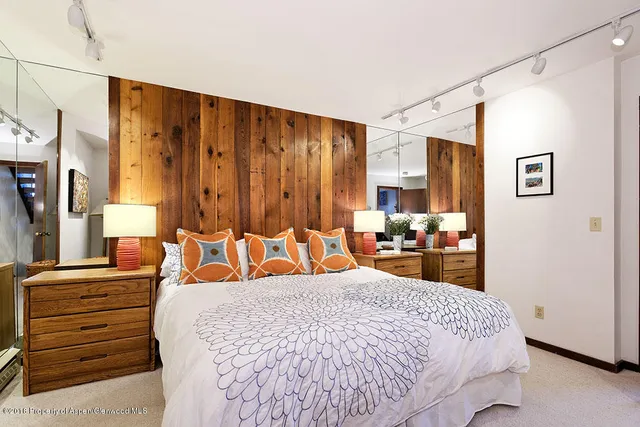 a view of a balcony with a table and chairs