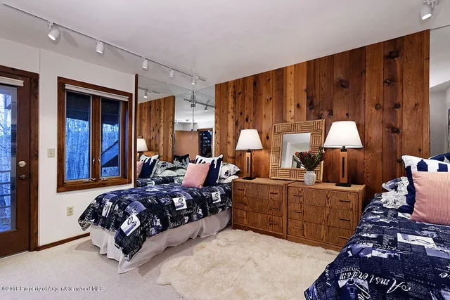 a bathroom with a sink double vanity and a mirror