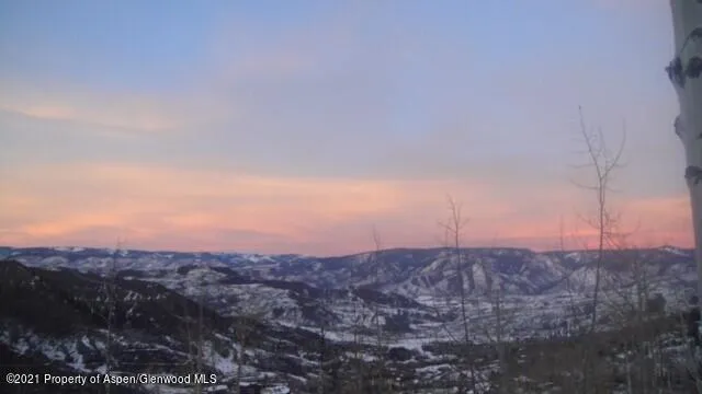 a view of a snow on the road