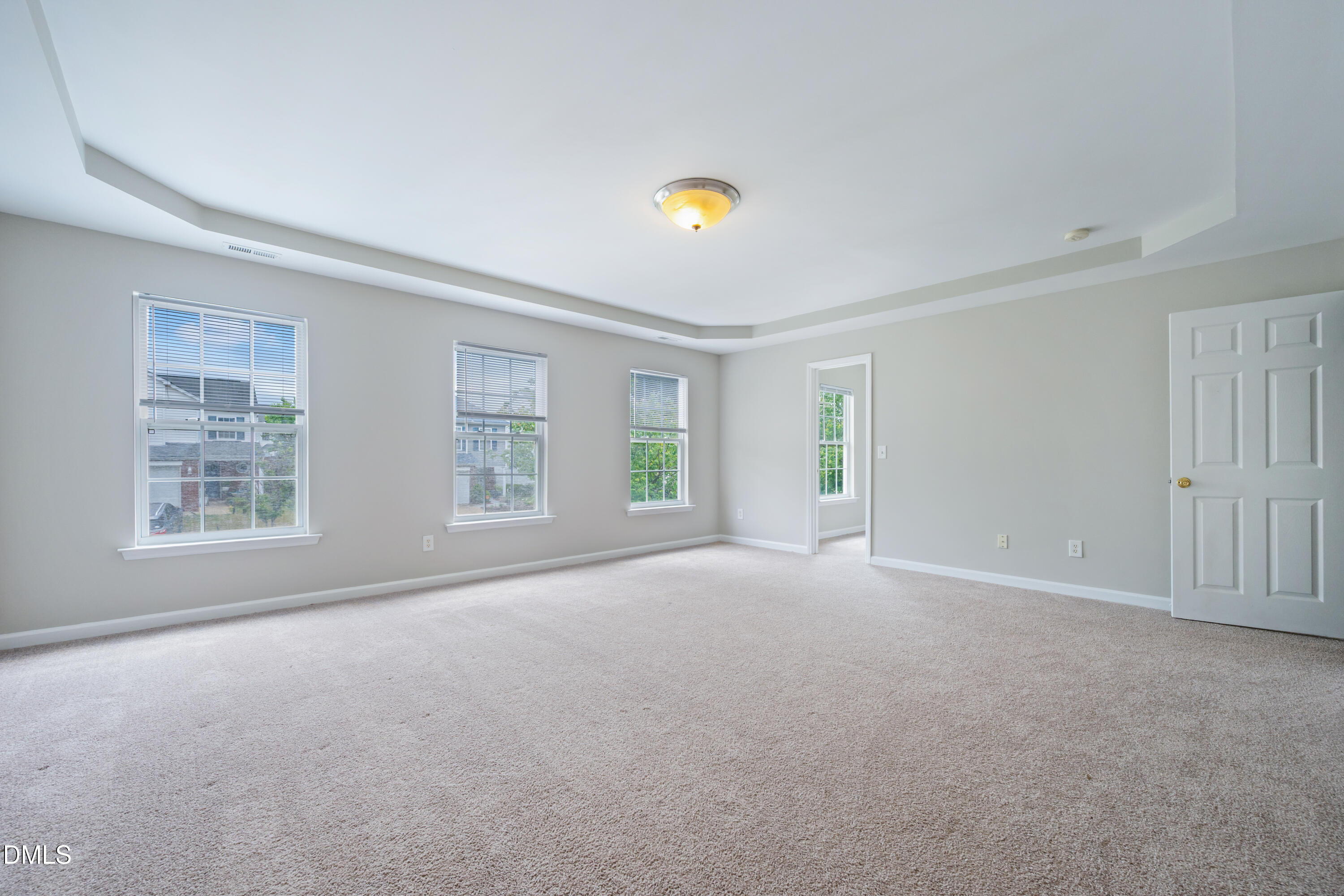 1532 Pebble Ridge Drive Raleigh, NC 27610 - Photo 25 of 40 a view of a big room with windows and chandelier fan