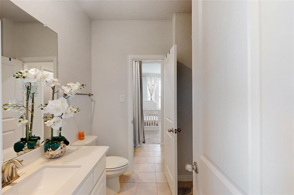 1997 Kieva Place Allen, TX 75013 - Photo 33 of 40 Bathroom featuring vanity and light tile patterned floors
