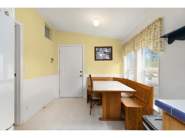 a balcony with table and chairs