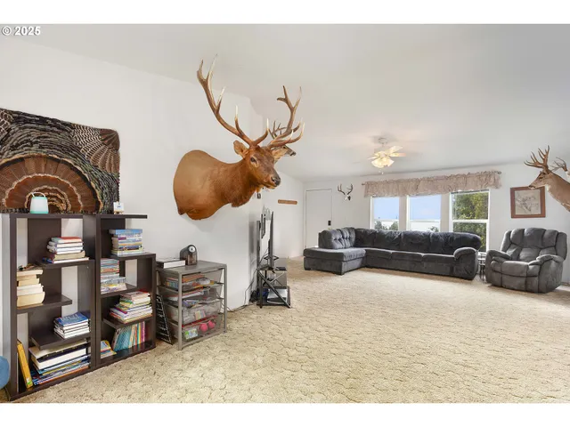 a bedroom with furniture and a mirror