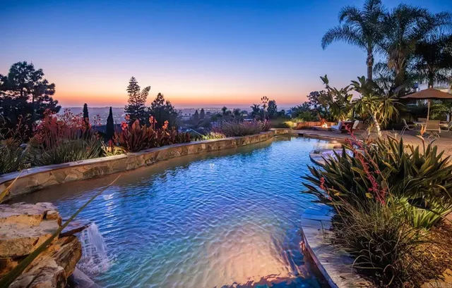 a view of a swimming pool with a house